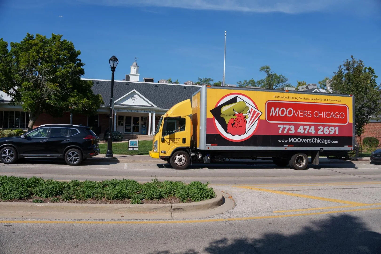 Moovers Chicago truck parked on a street, offering local and long-distance moving services.