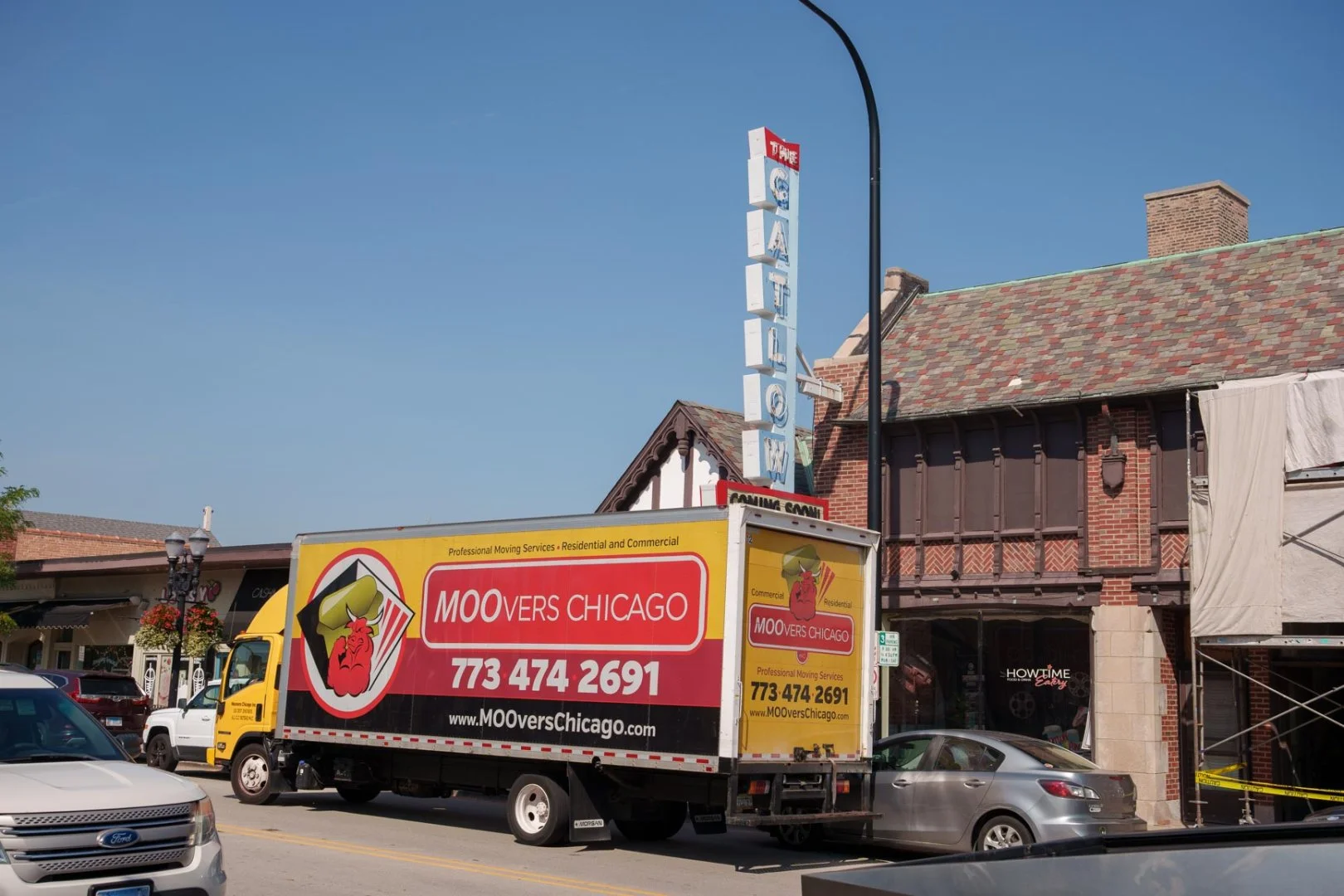 Moovers Chicago truck offering moving services on a city street in Barrington, IL.