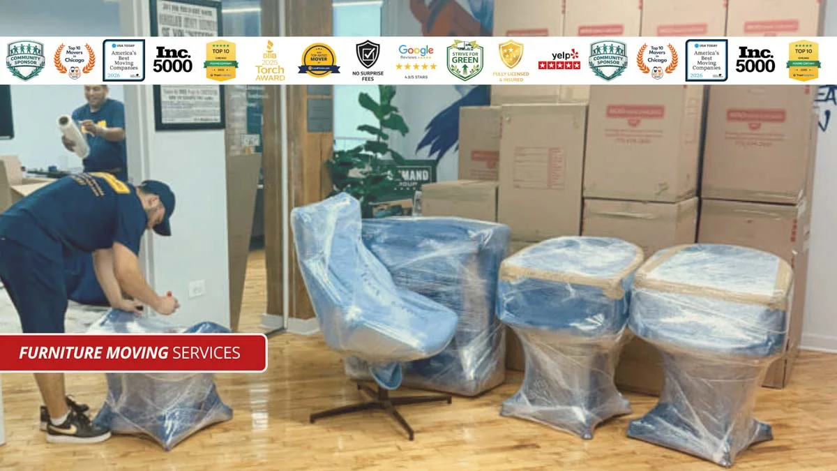 Professional movers wrapping furniture for moving services in Chicago.