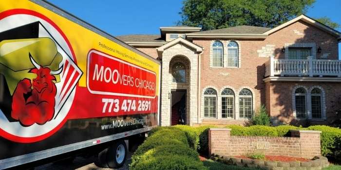 Moovers Chicago truck parked in front of a brick house, local and long distance moving services.